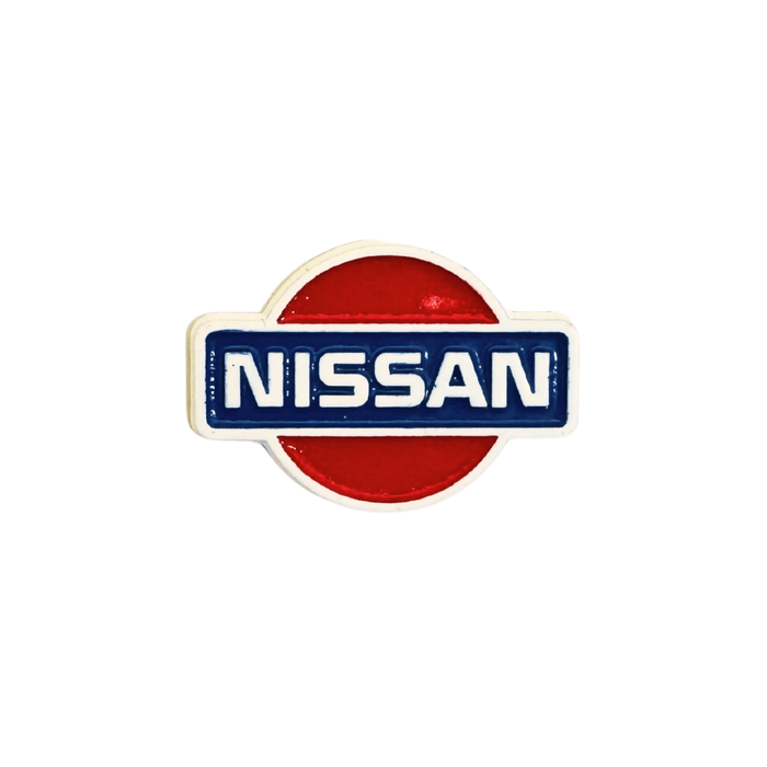 Nissan logo metal sticker with red and chrome finish, ideal for decoration – TaMiMi Projects in Qatar.