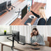 Black dual-arm desk mount with a monitor holder and a laptop holder, made of high-quality aluminum alloy, from TaMiMi Projects.
