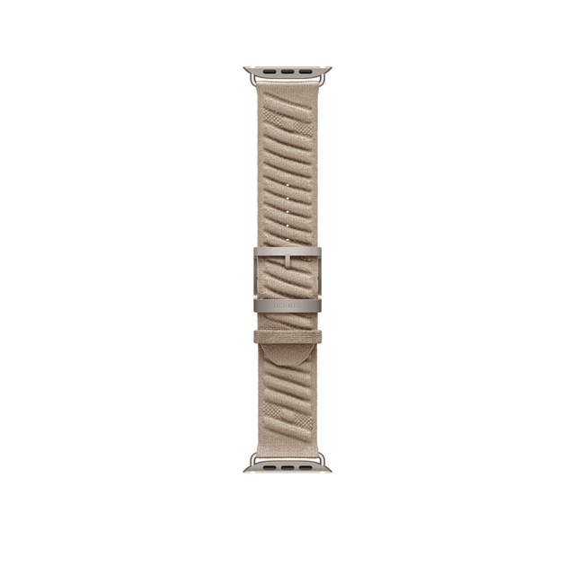 Argile 49mm Hermès En Mer Apple Watch band laid flat, showing the patterned fabric, titanium buckle and adjustment holes.