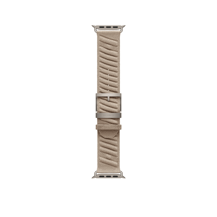 Argile 49mm Hermès En Mer Apple Watch band laid flat, showing the patterned fabric, titanium buckle and adjustment holes.