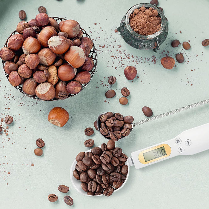 High-precision digital measuring spoon, 0.1g accuracy, available in white and black from TaMiMi Projects Qatar.