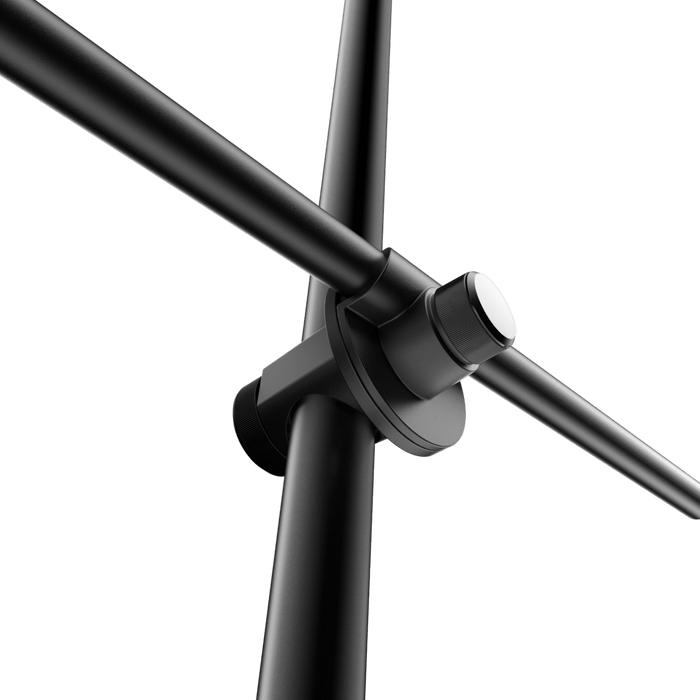 Sleek black ring light stand with a phone mount, showcasing its versatility for various uses.