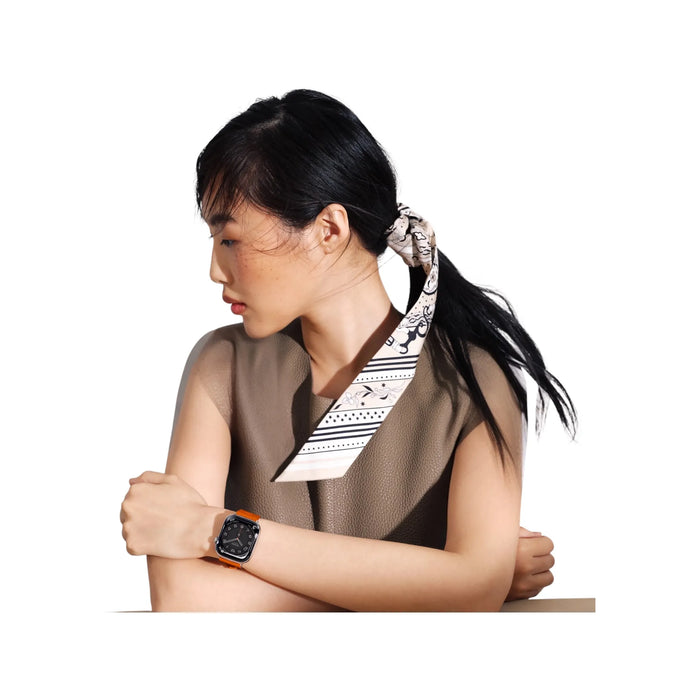 Apple Watch Hermès Series 11, 42mm Silver Titanium with Orange Kilim Single Tour, Available now from TaMiMi Projects in Qatar.